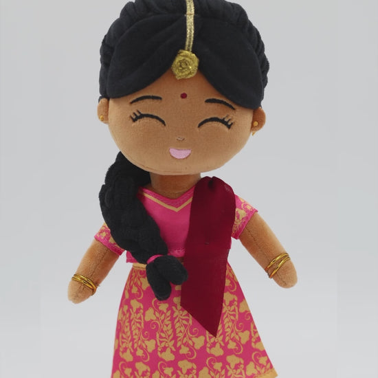 Front view of Priya Indian mini doll — 9” plush toy with pink and gold saree, red dupatta, and joyful expression, made for meaningful, imaginative play.