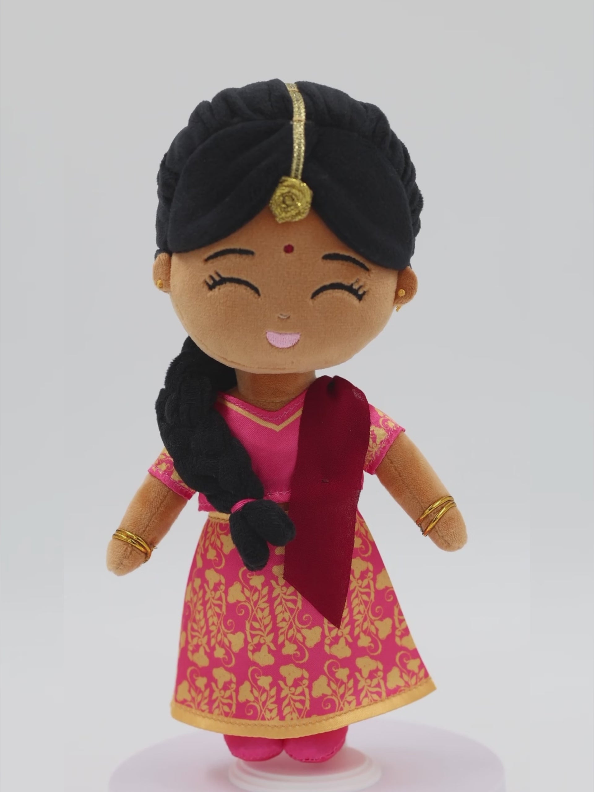 Front view of Priya Indian mini doll — 9” plush toy with pink and gold saree, red dupatta, and joyful expression, made for meaningful, imaginative play.